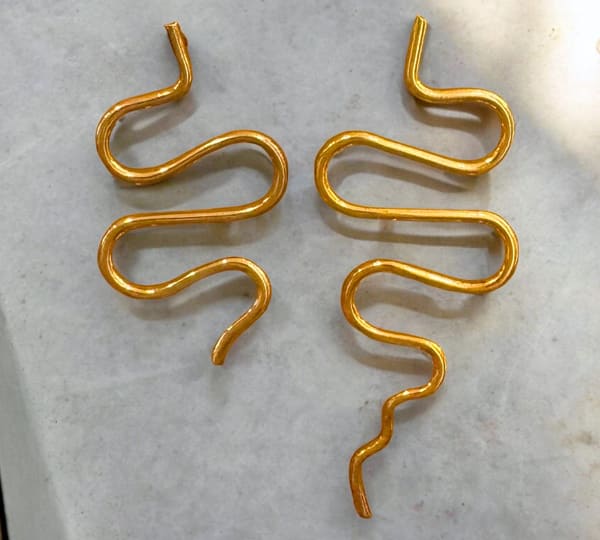 SNAKE DUO. Asymmetrical Serpents. plated with 24k gold